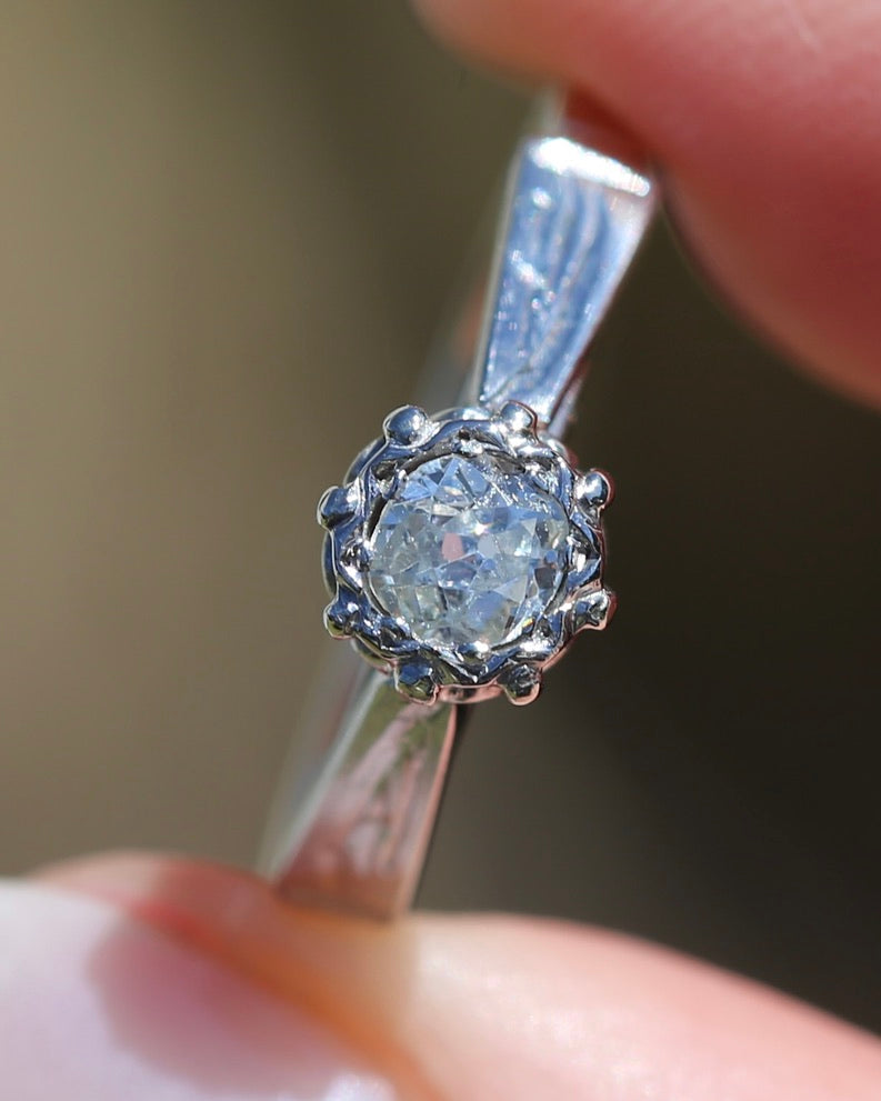 0.22ct old cut diamond solitaire, Platinum and Pale 18ct Gold, size P1/2