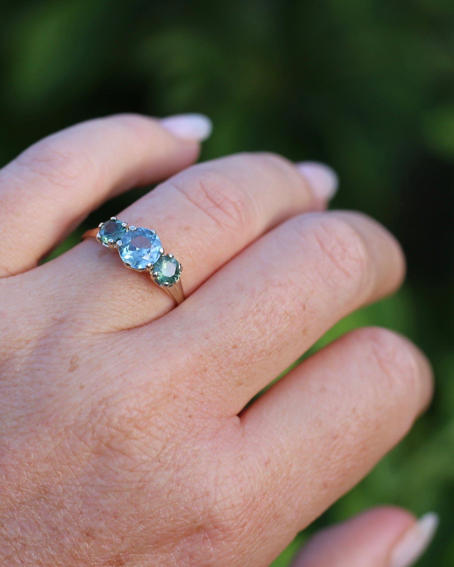 1.65ct Blue Zircon and 097ct Parti Sapphire Trilogy, 9ct Yellow Gold, size R1/2 or 8.75
