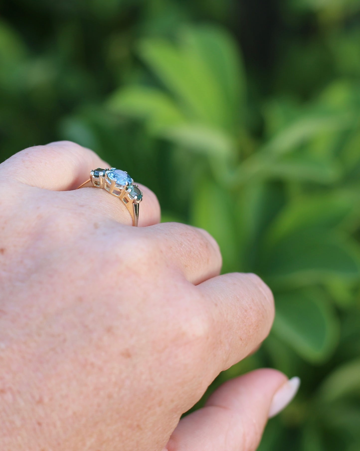 1.65ct Blue Zircon and 097ct Parti Sapphire Trilogy, 9ct Yellow Gold, size R1/2 or 8.75
