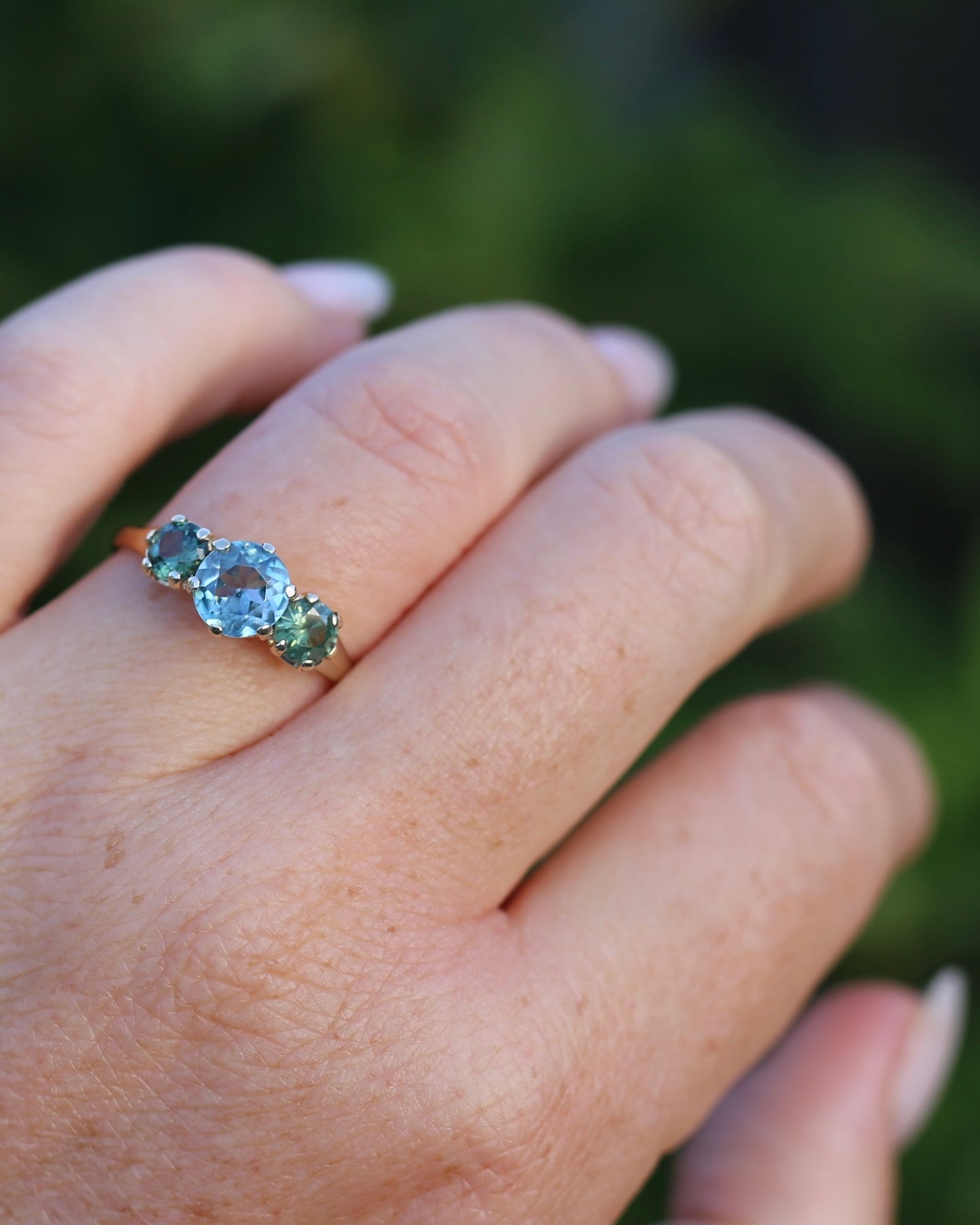 1.65ct Blue Zircon and 097ct Parti Sapphire Trilogy, 9ct Yellow Gold, size R1/2 or 8.75