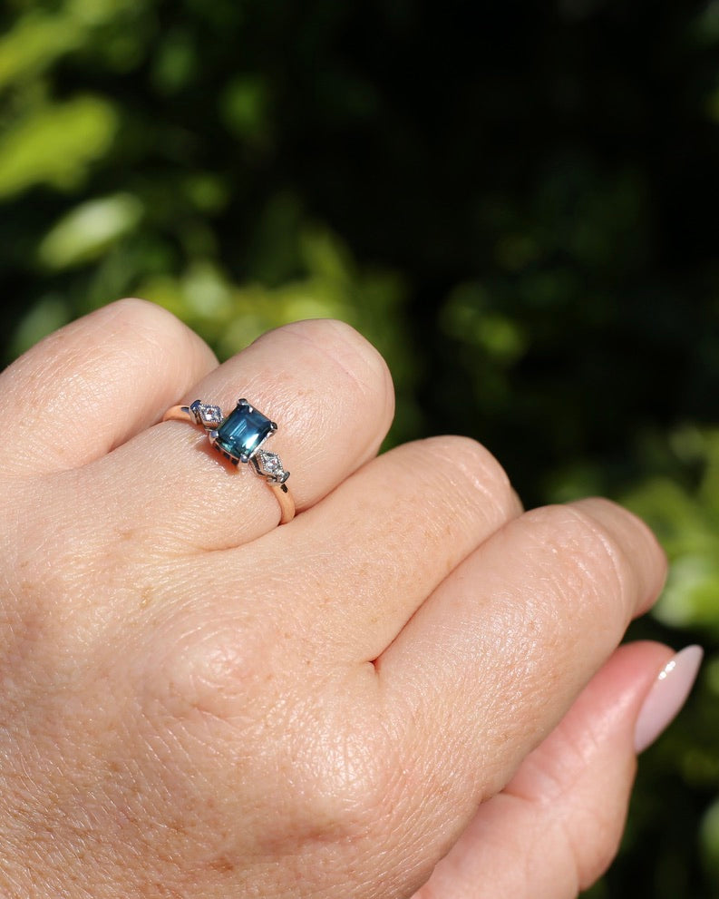 1.09ct Emerald Cut Teal Australian Sapphire With Diamonds in Vintage Trilogy Setting, 9ct Yellow and White Gold, size N1/2 or 6.75, 2.05g