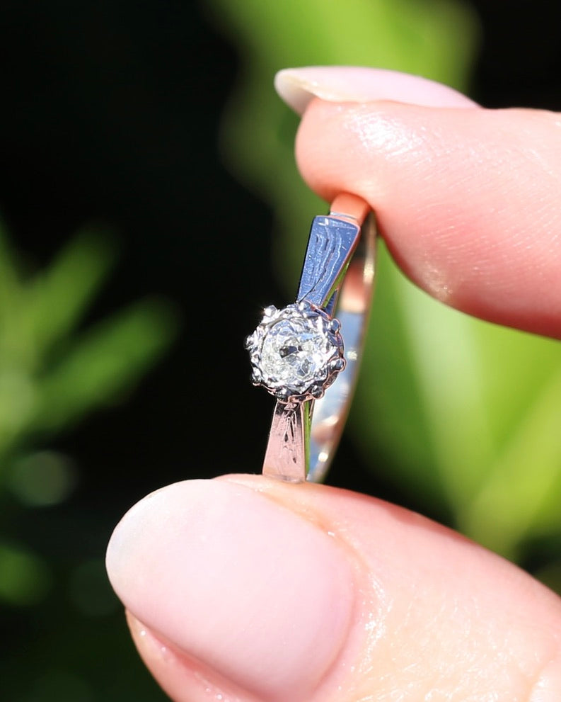 0.22ct old cut diamond solitaire, Platinum and Pale 18ct Gold, size P1/2