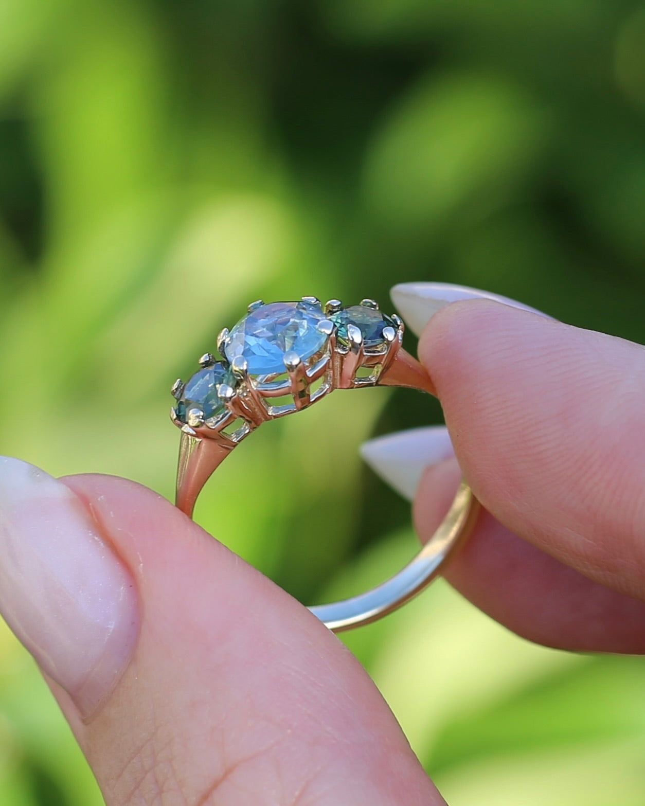 1.65ct Blue Zircon and 097ct Parti Sapphire Trilogy, 9ct Yellow Gold, size R1/2 or 8.75