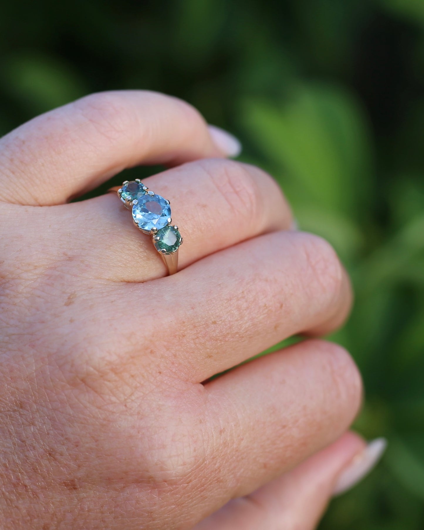 1.65ct Blue Zircon and 097ct Parti Sapphire Trilogy, 9ct Yellow Gold, size R1/2 or 8.75