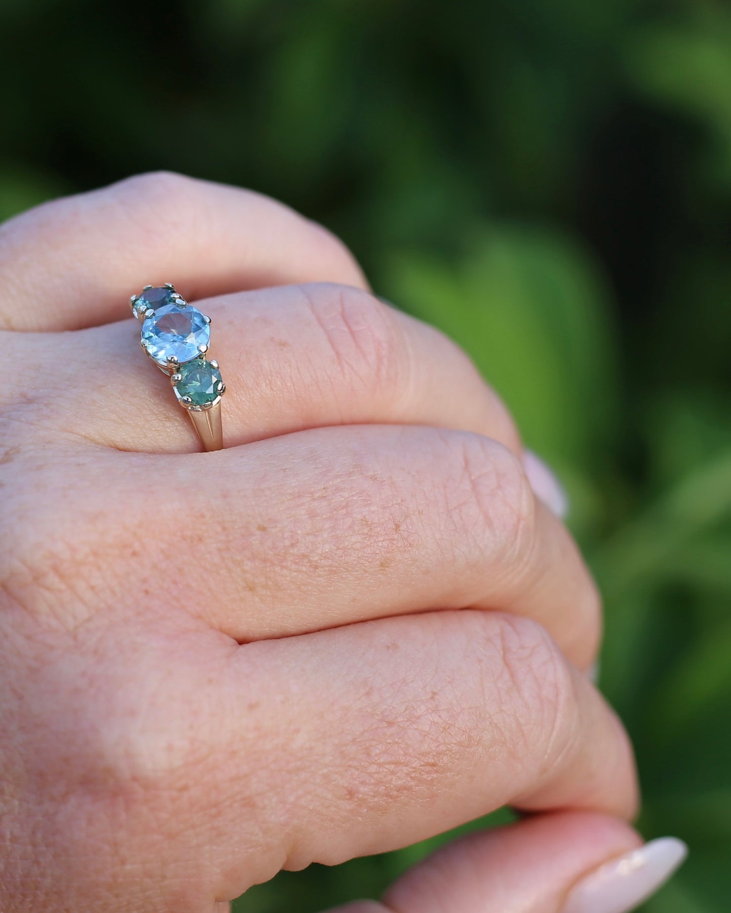 1.65ct Blue Zircon and 097ct Parti Sapphire Trilogy, 9ct Yellow Gold, size R1/2 or 8.75