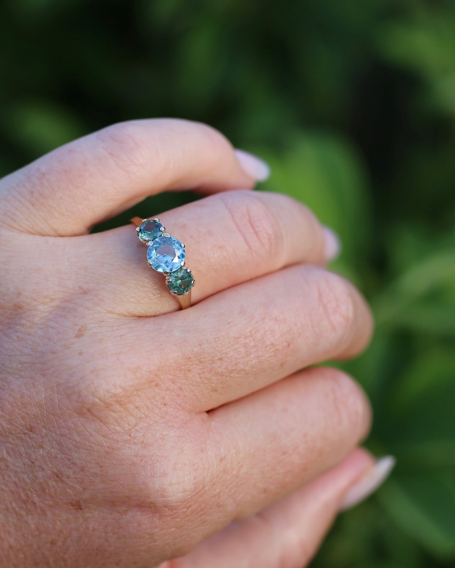 1.65ct Blue Zircon and 097ct Parti Sapphire Trilogy, 9ct Yellow Gold, size R1/2 or 8.75
