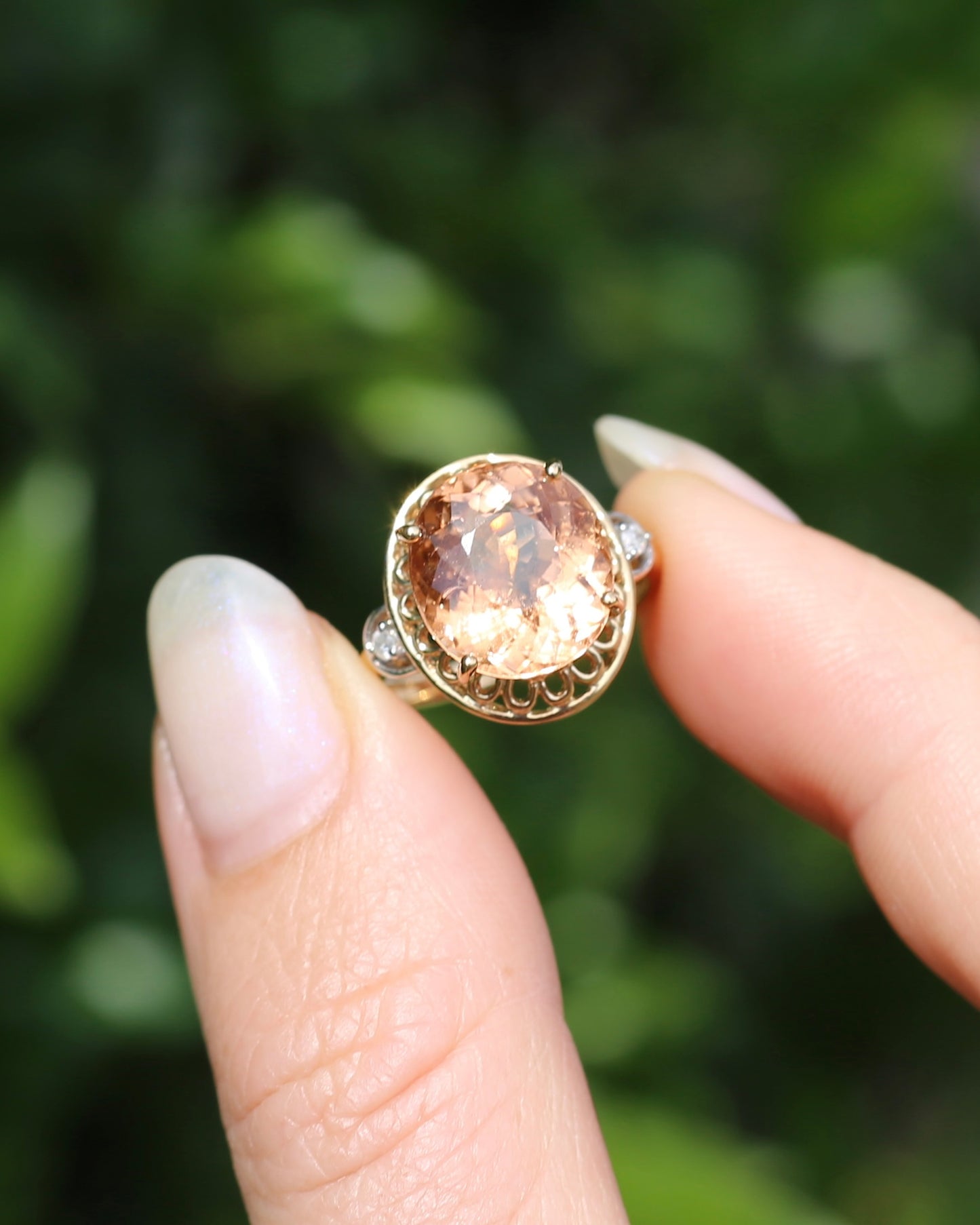 Oval Peach Tourmaline Ring with Pierced Wire Surrounds and Diamonds in the Shoulders, 9ct Yellow Gold, size N or 6.75