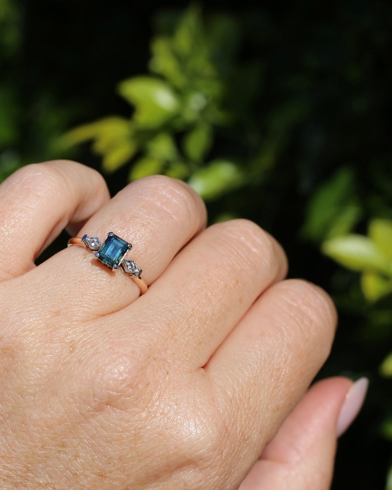 1.09ct Emerald Cut Teal Australian Sapphire With Diamonds in Vintage Trilogy Setting, 9ct Yellow and White Gold, size N1/2 or 6.75, 2.05g