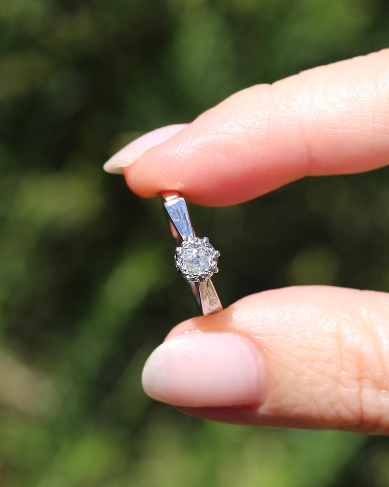 0.22ct old cut diamond solitaire, Platinum and Pale 18ct Gold, size P1/2