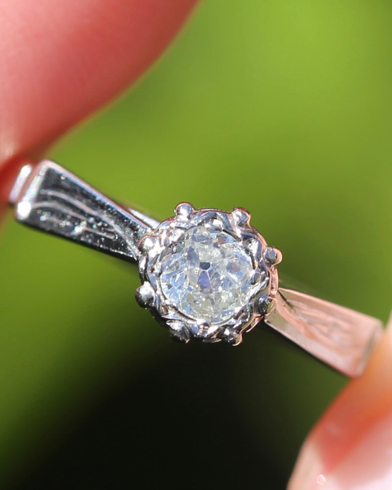 0.22ct old cut diamond solitaire, Platinum and Pale 18ct Gold, size P1/2