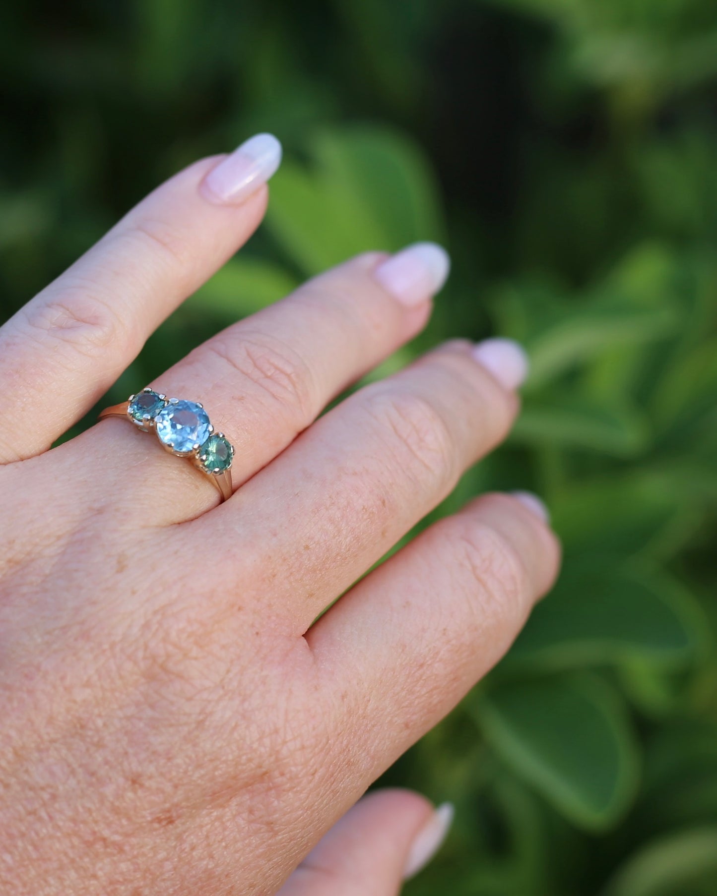 1.65ct Blue Zircon and 097ct Parti Sapphire Trilogy, 9ct Yellow Gold, size R1/2 or 8.75