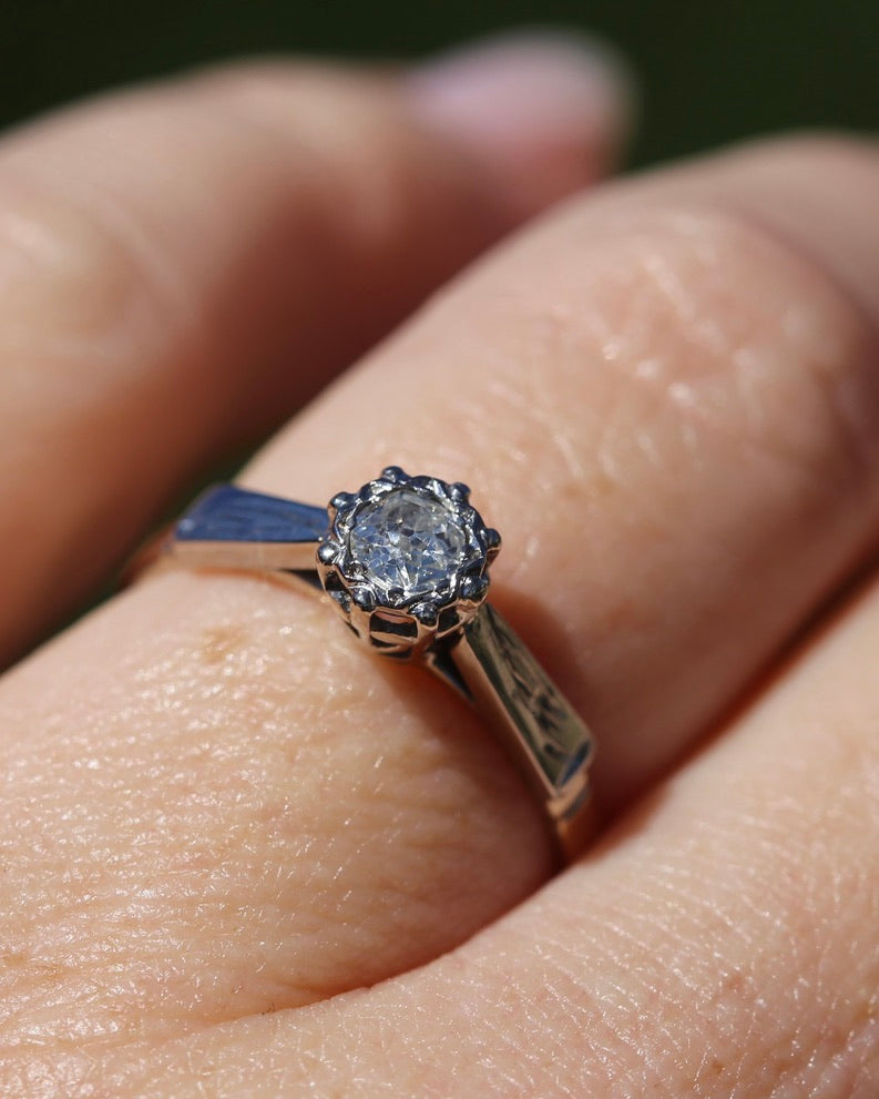 0.22ct old cut diamond solitaire, Platinum and Pale 18ct Gold, size P1/2