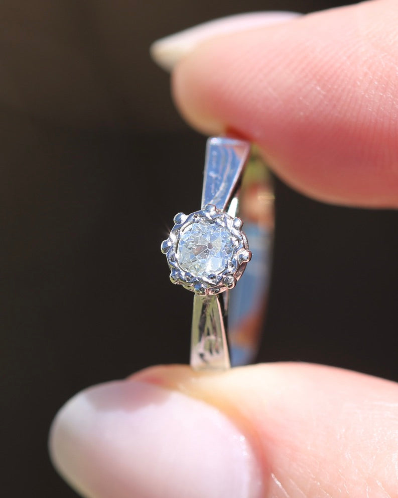 0.22ct old cut diamond solitaire, Platinum and Pale 18ct Gold, size P1/2