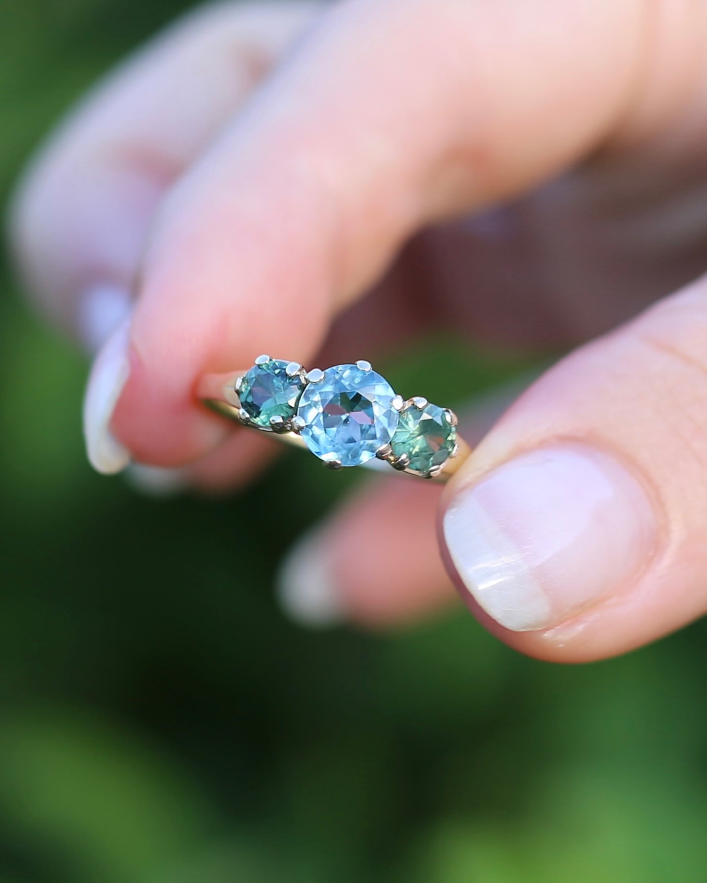 1.65ct Blue Zircon and 097ct Parti Sapphire Trilogy, 9ct Yellow Gold, size R1/2 or 8.75