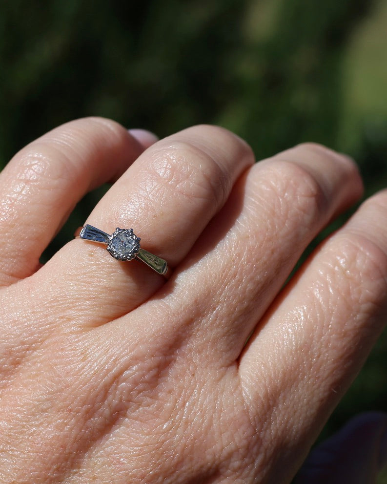 0.22ct old cut diamond solitaire, Platinum and Pale 18ct Gold, size P1/2