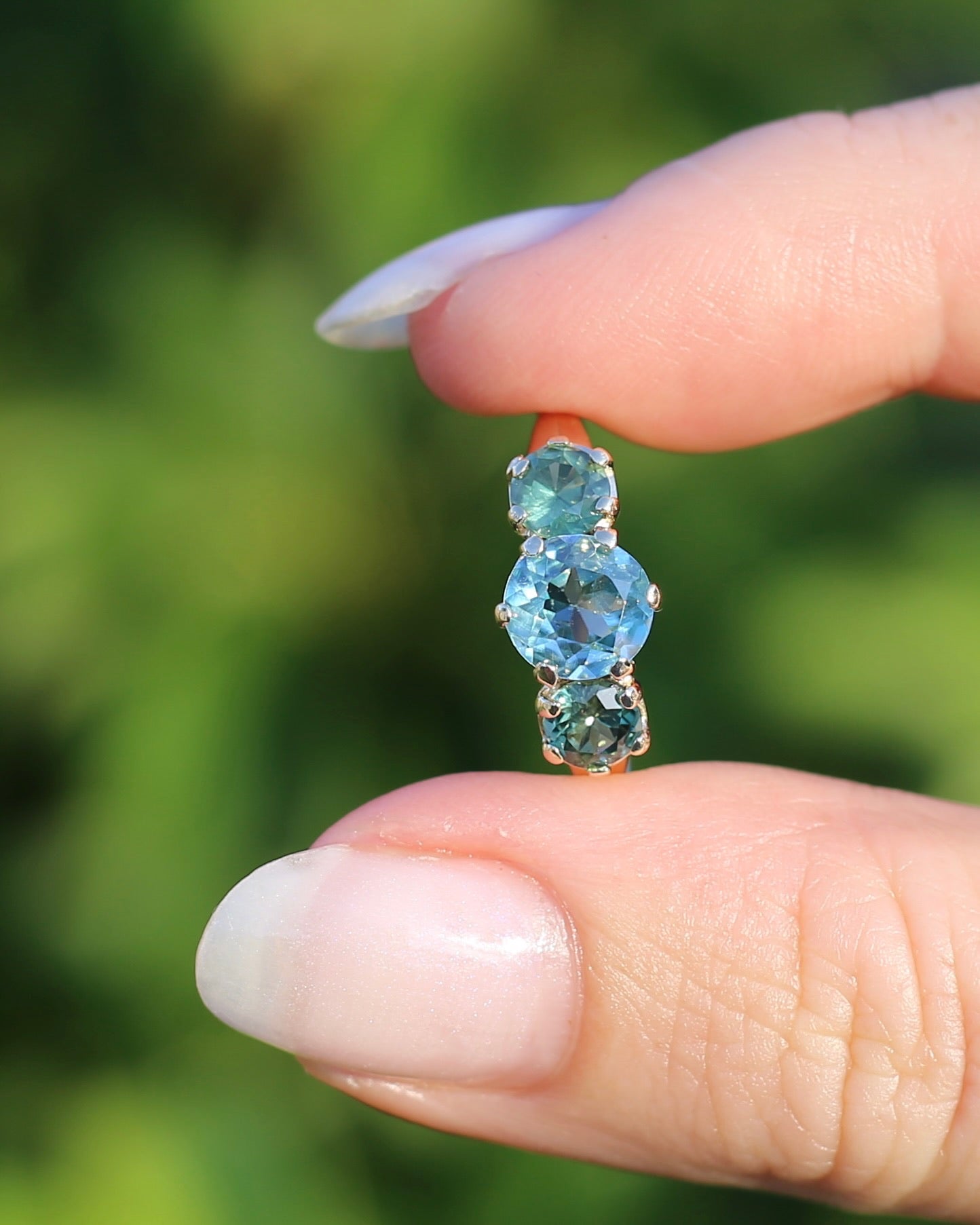 1.65ct Blue Zircon and 097ct Parti Sapphire Trilogy, 9ct Yellow Gold, size R1/2 or 8.75