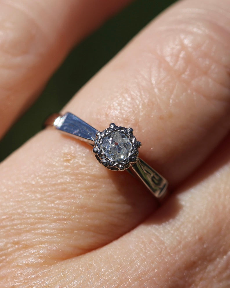 0.22ct old cut diamond solitaire, Platinum and Pale 18ct Gold, size P1/2