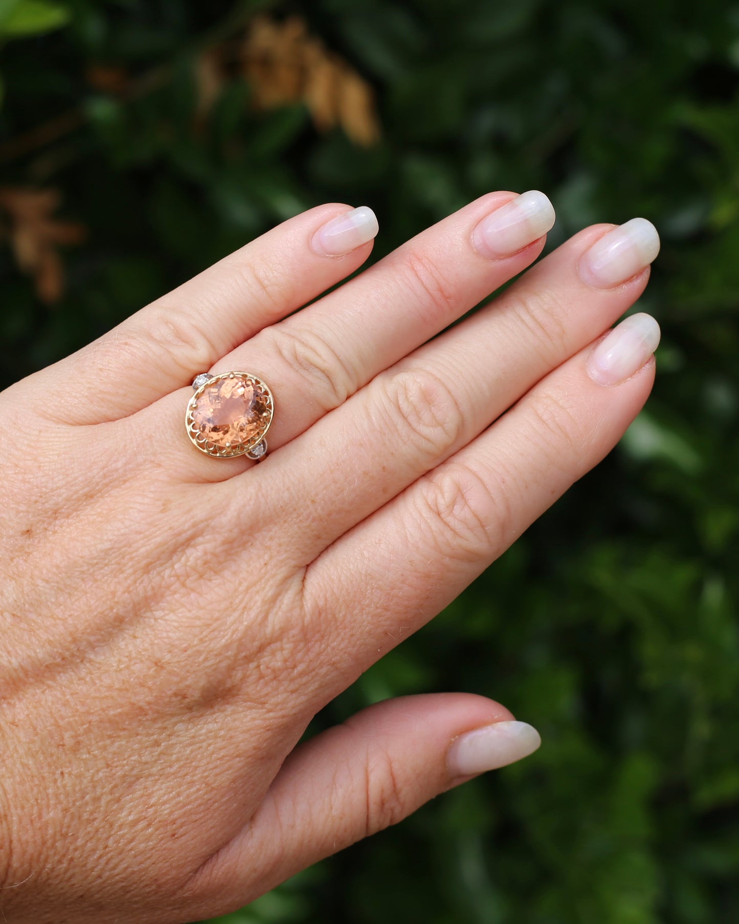 Oval Peach Tourmaline Ring with Pierced Wire Surrounds and Diamonds in the Shoulders, 9ct Yellow Gold, size N or 6.75