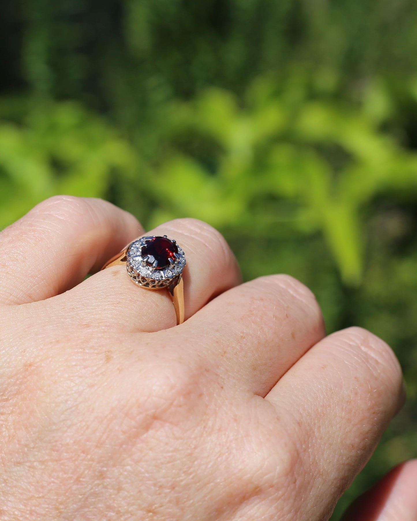 1974 Made Garnet and Diamond Halo Ring, 9ct Yellow and White Gold, size M1/2 or 6.5, 2.83g