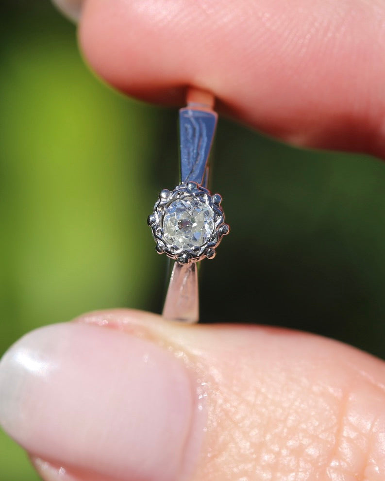 0.22ct old cut diamond solitaire, Platinum and Pale 18ct Gold, size P1/2