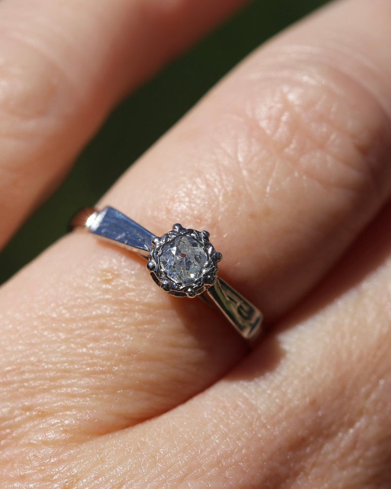 0.22ct old cut diamond solitaire, Platinum and Pale 18ct Gold, size P1/2