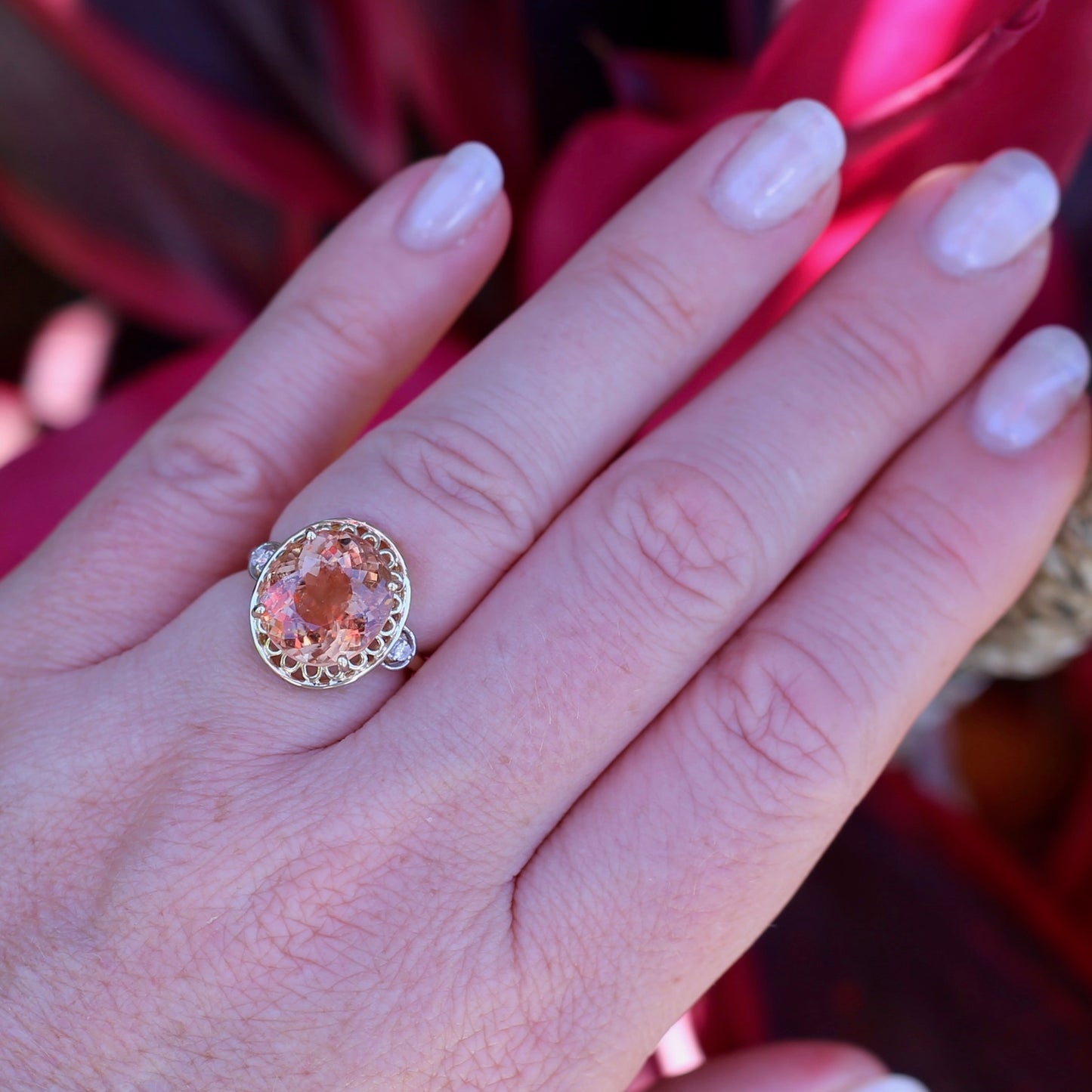 Oval Pale Orange Tourmaline Ring with Pierced Wire Surrounds and Diamonds in the Shoulders, 9ct Yellow Gold, size N or 6.75