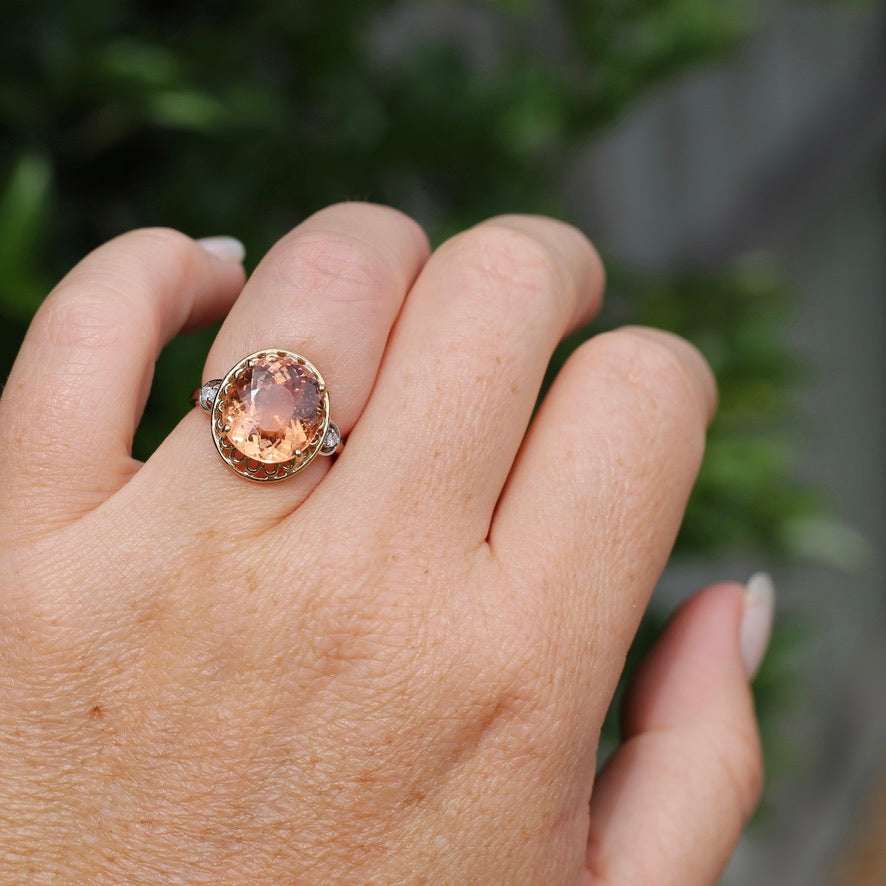 Oval Peach Tourmaline Ring with Pierced Wire Surrounds and Diamonds in the Shoulders, 9ct Yellow Gold, size N or 6.75