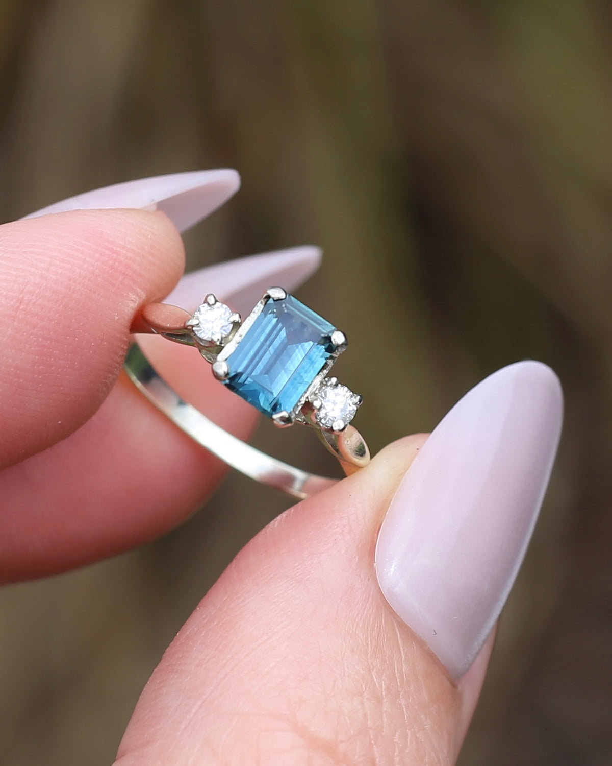 1.1ct Emerald Cut Natural Blue Teal Sapphire and Diamond Trilogy, 18ct White Gold and Platinum, size O or just over 7, 2.27g
