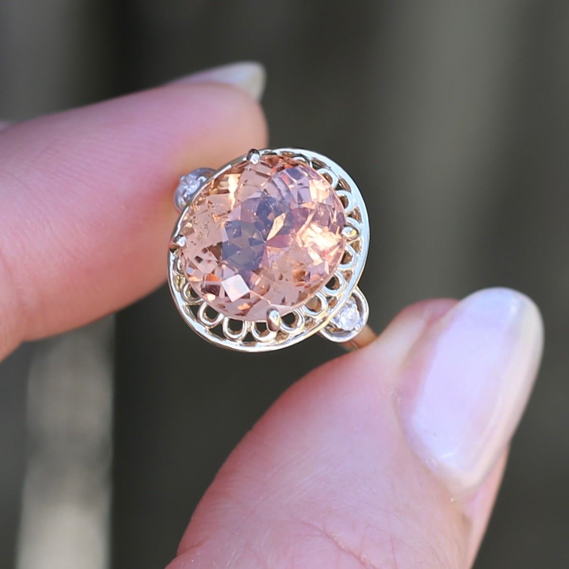 Oval Peach Tourmaline Ring with Pierced Wire Surrounds and Diamonds in the Shoulders, 9ct Yellow Gold, size N or 6.75