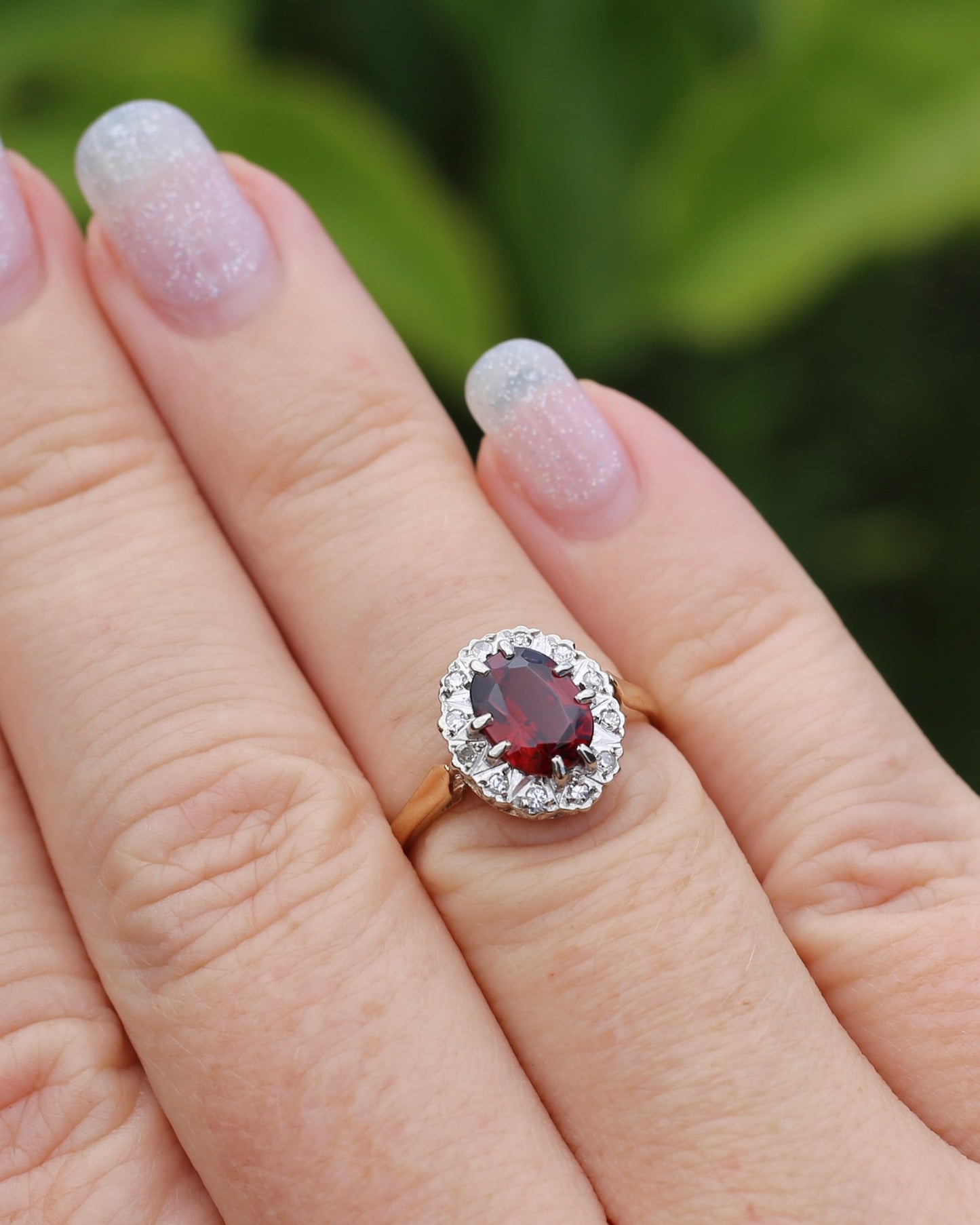 1974 Made Garnet and Diamond Halo Ring, 9ct Yellow and White Gold, size M1/2 or 6.5, 2.83g