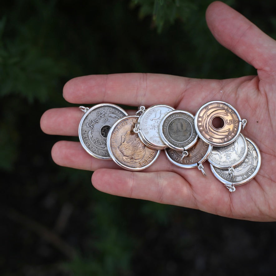 Global Coins in Silver Bezel Frames