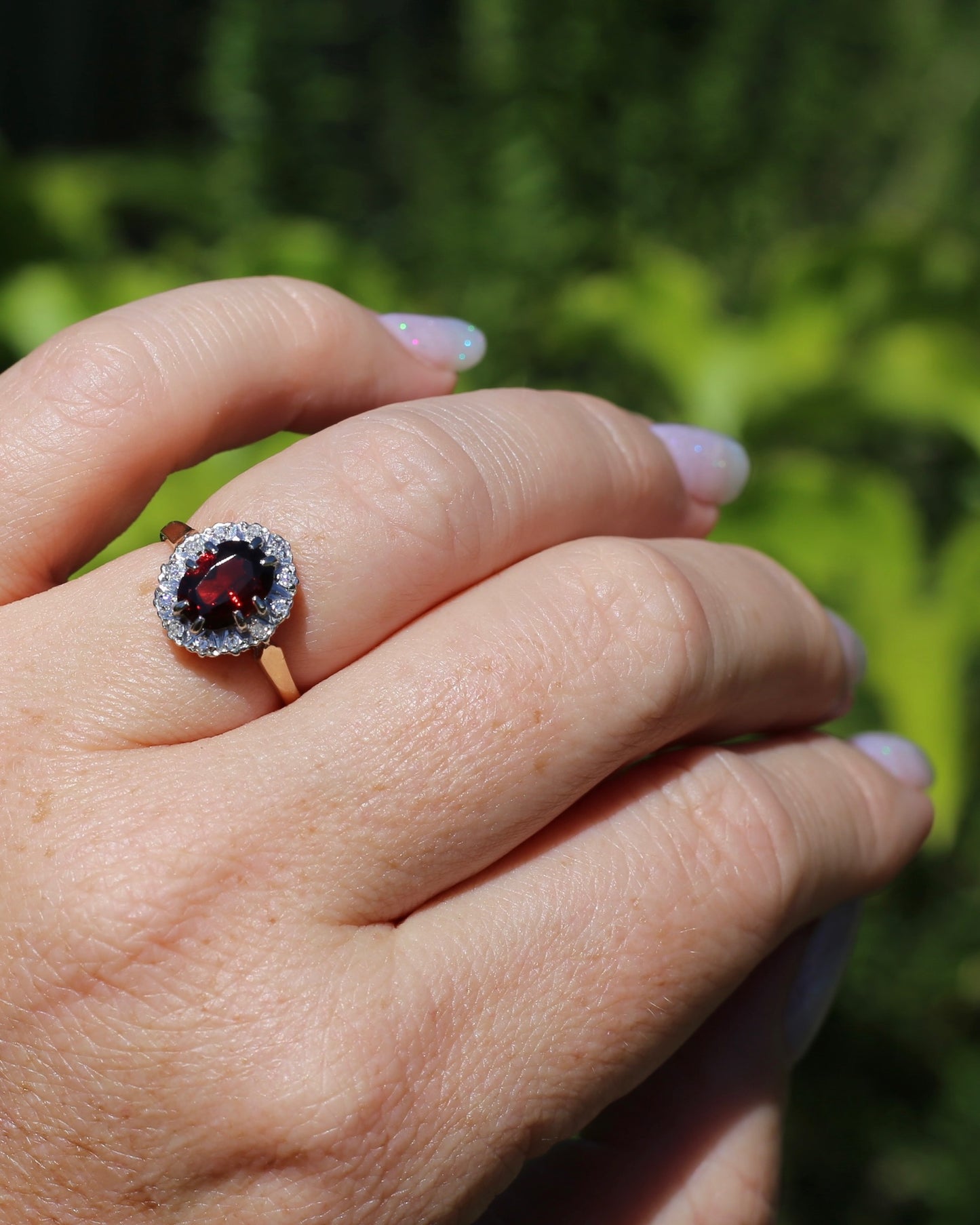 1974 Made Garnet and Diamond Halo Ring, 9ct Yellow and White Gold, size M1/2 or 6.5, 2.83g