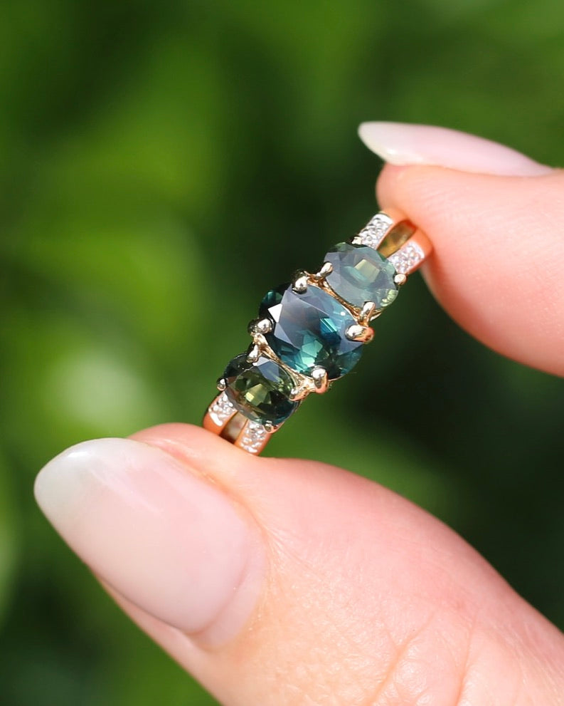 2.49ct Australian Green and Parti Sapphire Trilogy with diamond side stones, 10ct Yellow Gold, size 7 or just over N1/2, 3.38g