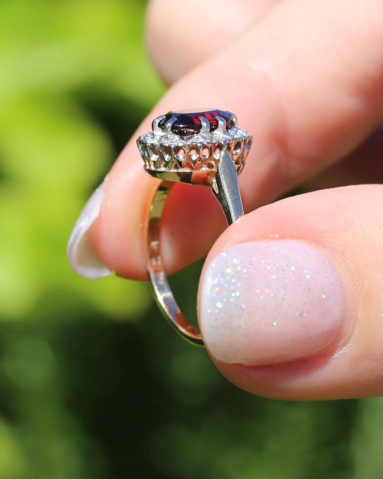 1974 Made Garnet and Diamond Halo Ring, 9ct Yellow and White Gold, size M1/2 or 6.5, 2.83g