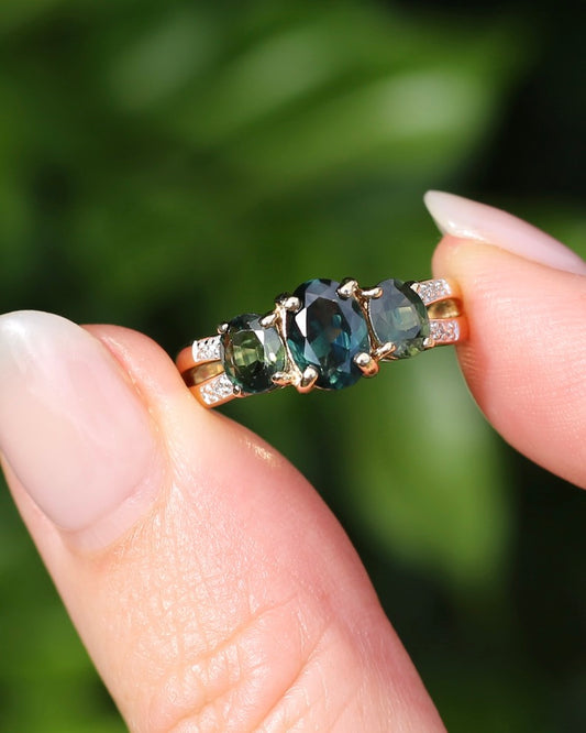 2.49ct Australian Green and Parti Sapphire Trilogy with diamond side stones, 10ct Yellow Gold, size 7 or just over N1/2, 3.38g