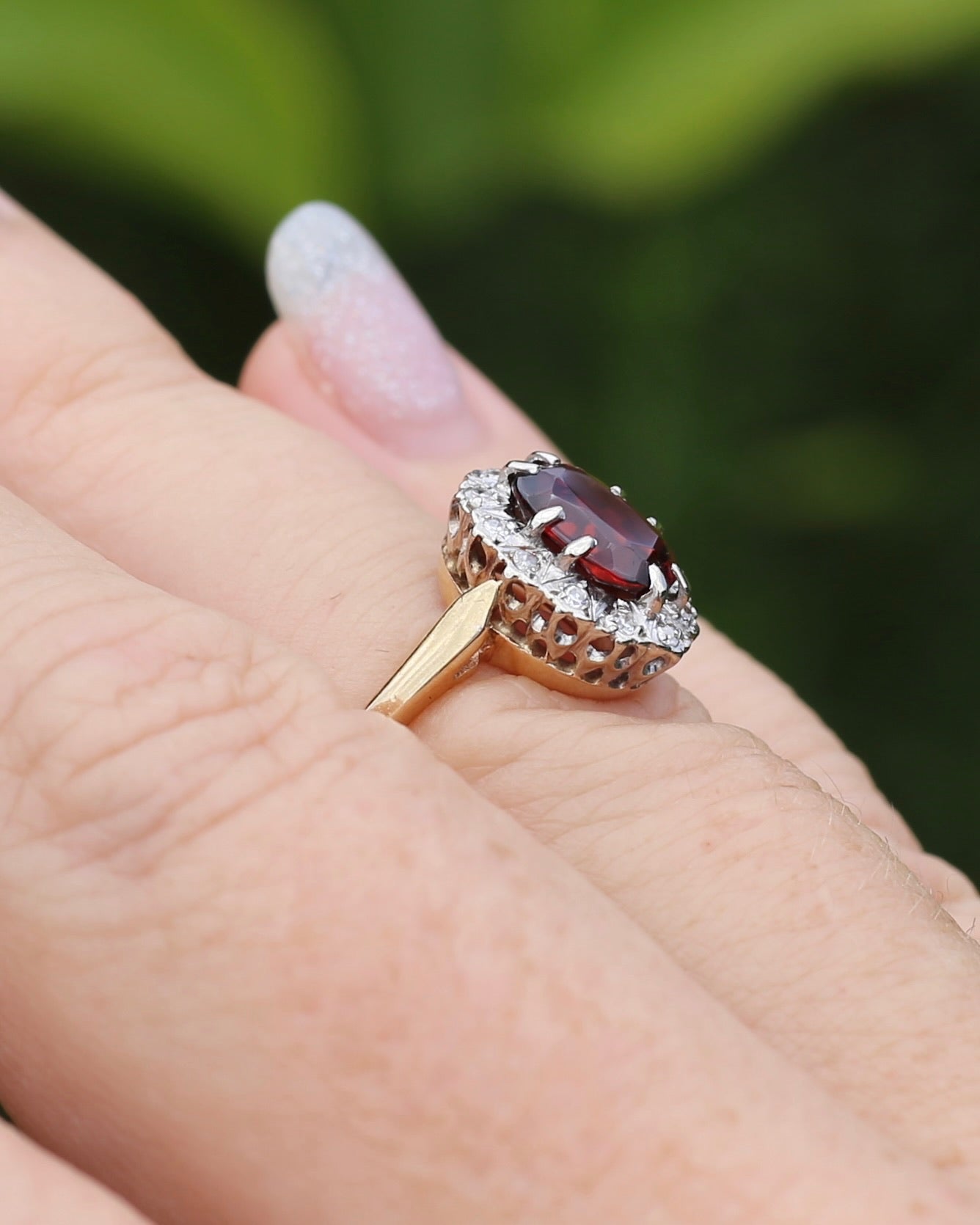 1974 Made Garnet and Diamond Halo Ring, 9ct Yellow and White Gold, size M1/2 or 6.5, 2.83g