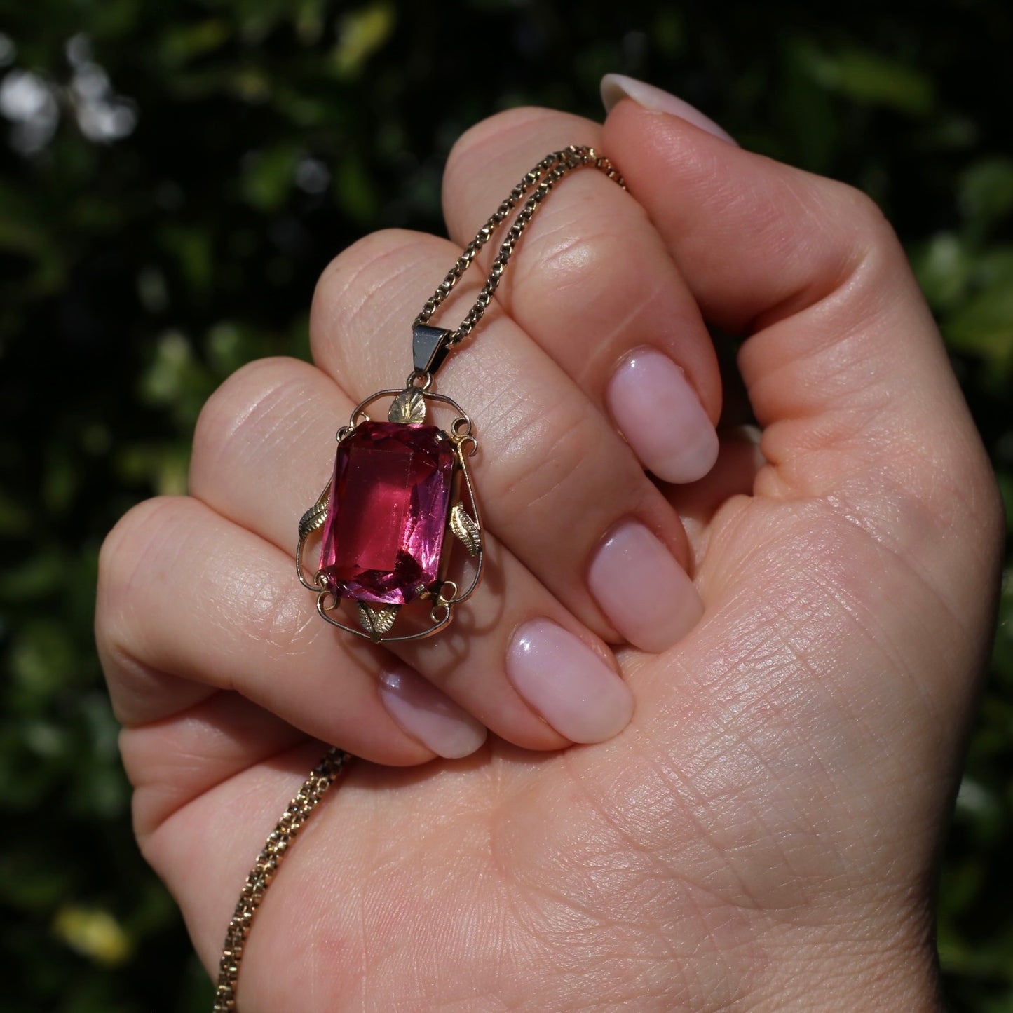 Circa 1930s-1950s Pink Paste Pendant in Decorative 9ct Gold Leaf Surround, 4.95g