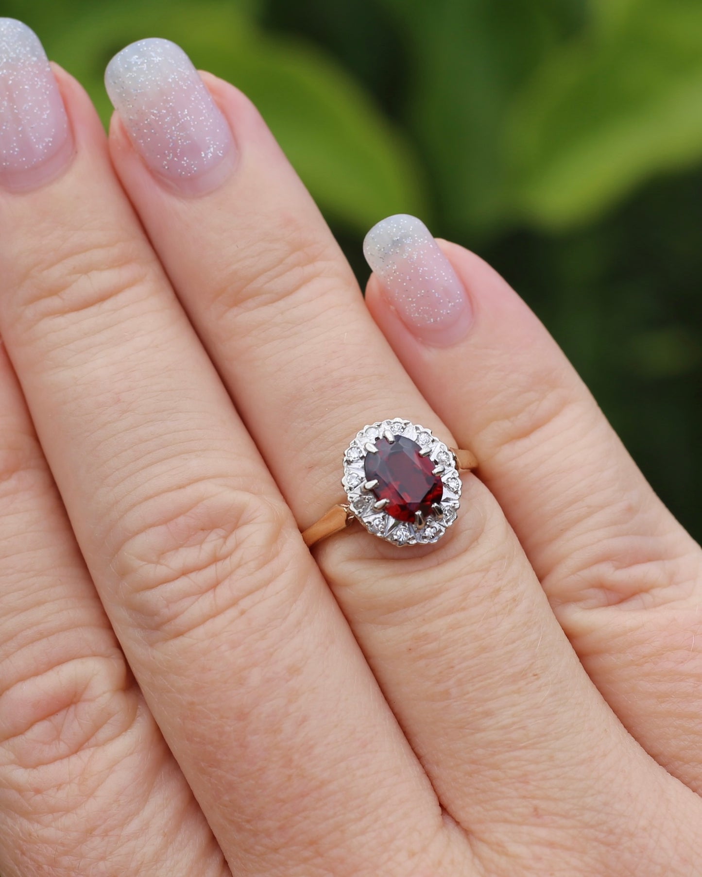 1974 Made Garnet and Diamond Halo Ring, 9ct Yellow and White Gold, size M1/2 or 6.5, 2.83g