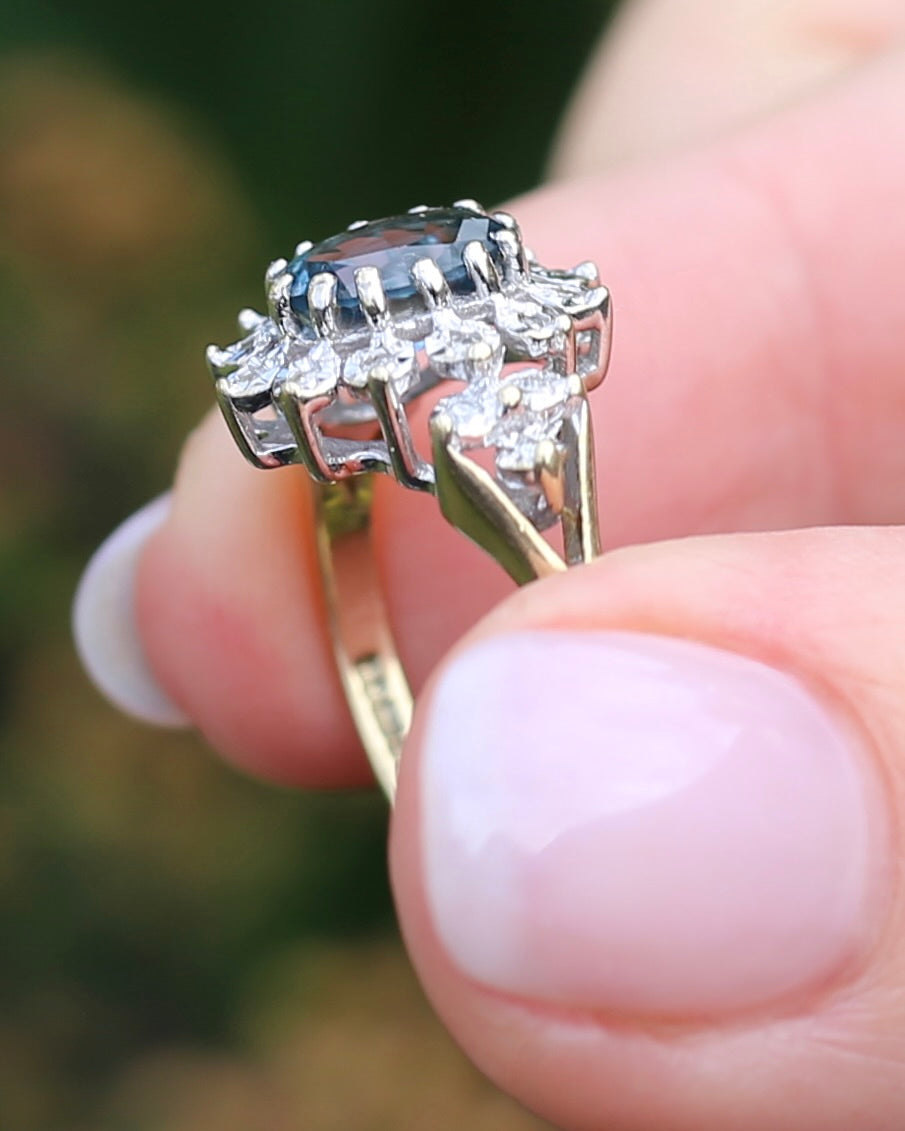 1989 Blue Zircon and Diamond Halo Ring, 9ct Yellow and White Gold, size N1/2 or 7, 3.18g
