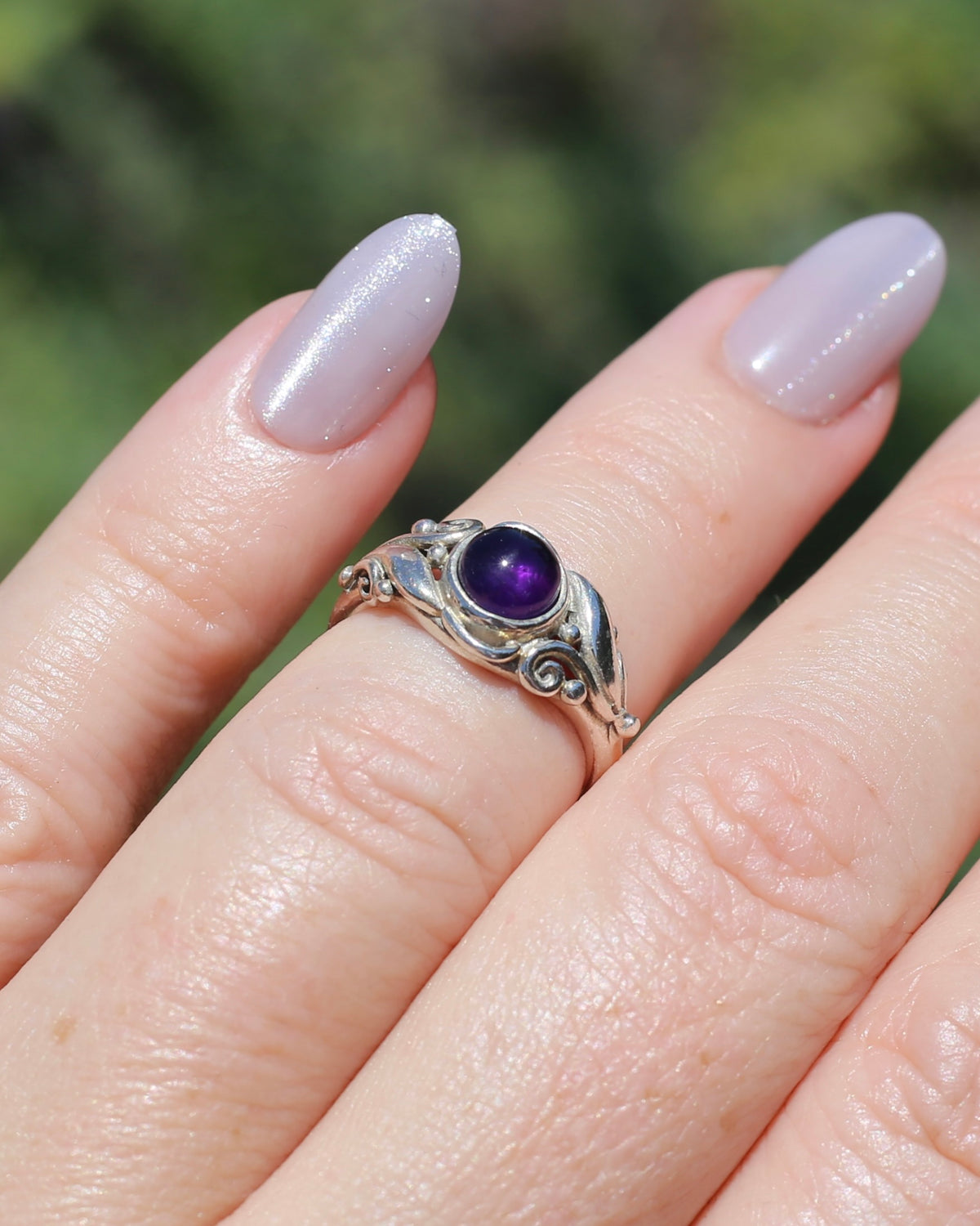 Amethyst Cabochon in Bezel Setting and Leaf & Swirl Surrounds, Sterling Silver, size J1/2 or 5, 3.38g