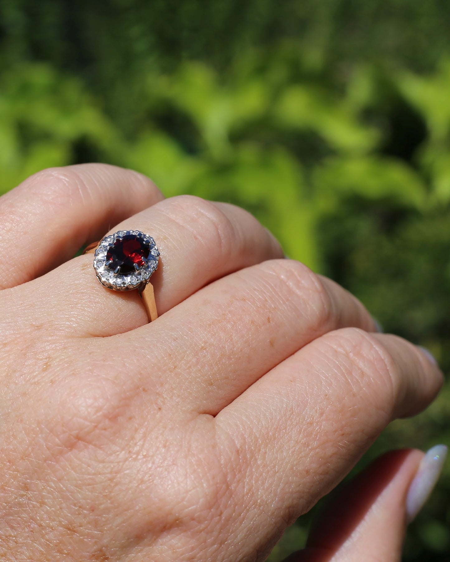 1974 Made Garnet and Diamond Halo Ring, 9ct Yellow and White Gold, size M1/2 or 6.5, 2.83g