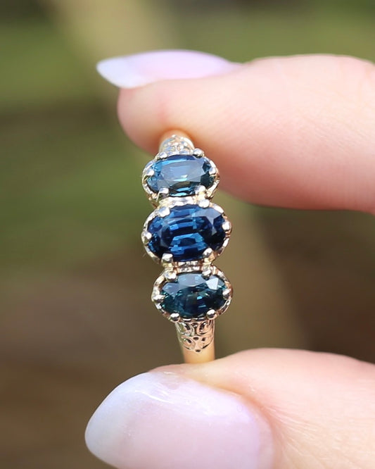 Unheated Blue and Teal Sapphire Trilogy, 9ct Vintage Yellow Gold, size U1/2 or 10.25, 3.22g, with valuation