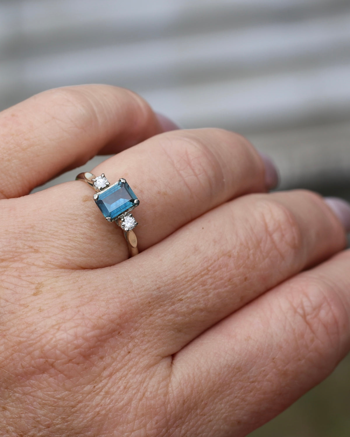 1.1ct Emerald Cut Natural Blue Teal Sapphire and Diamond Trilogy, 18ct White Gold and Platinum, size O or just over 7, 2.27g