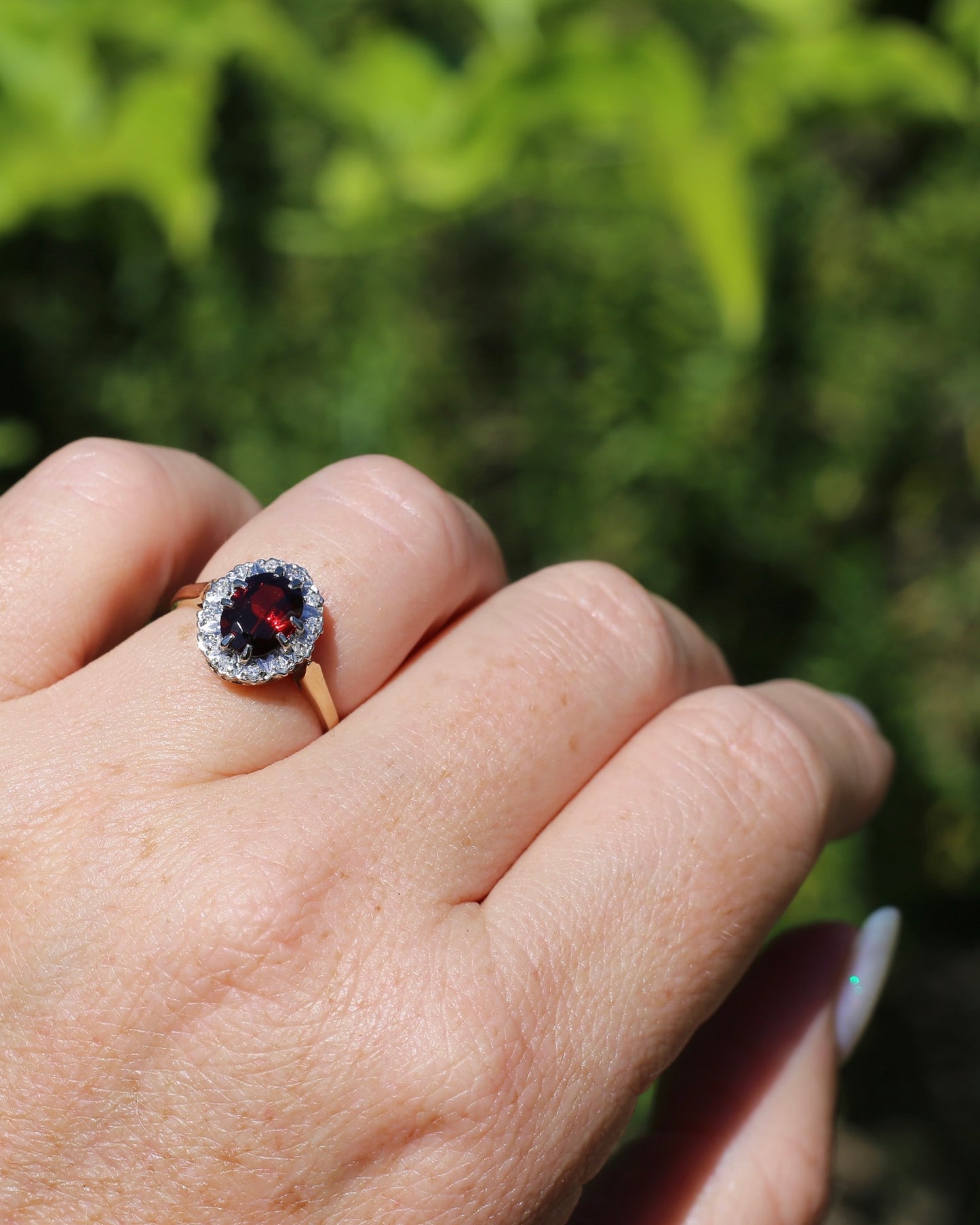 1974 Made Garnet and Diamond Halo Ring, 9ct Yellow and White Gold, size M1/2 or 6.5, 2.83g
