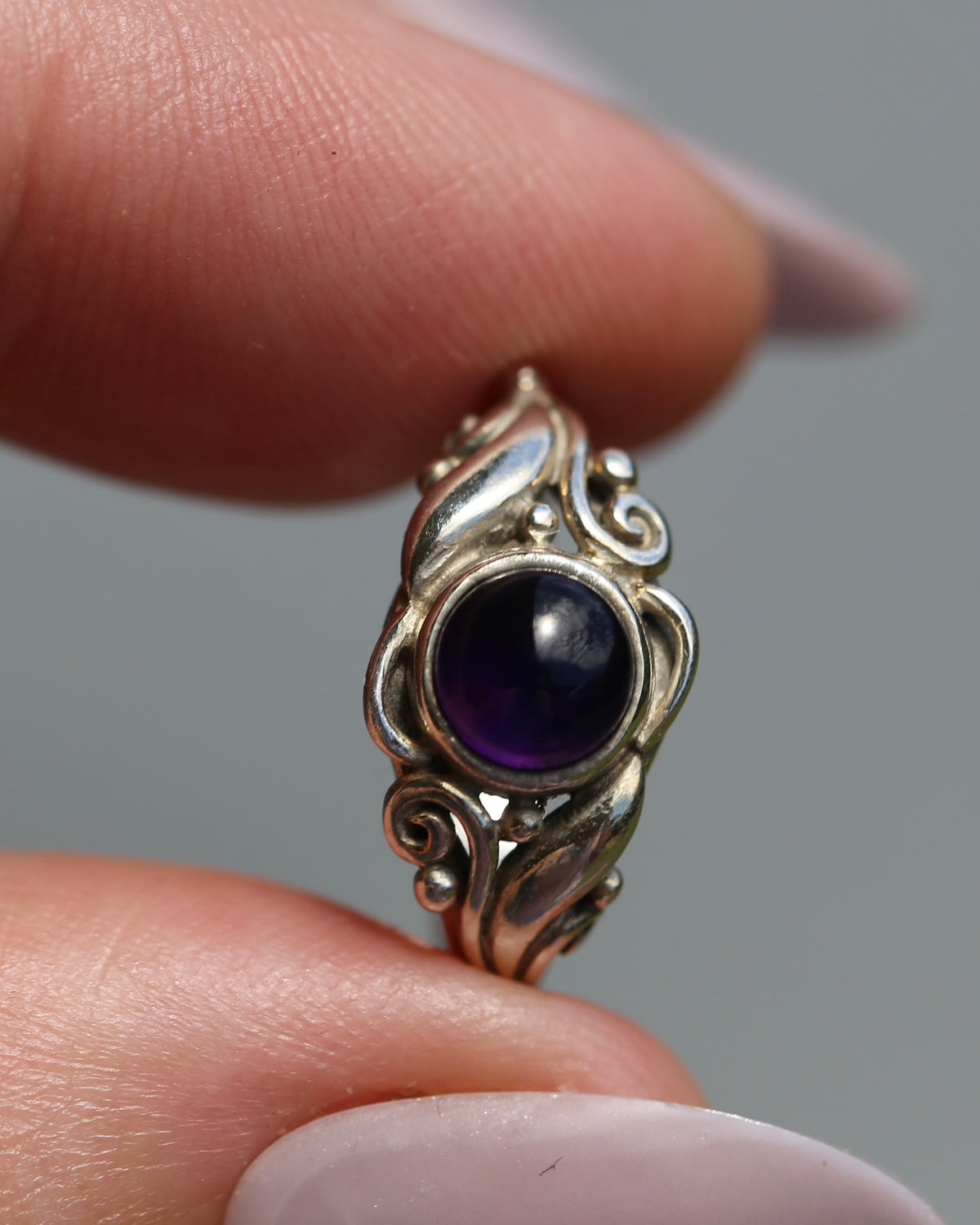 Amethyst Cabochon in Bezel Setting and Leaf & Swirl Surrounds, Sterling Silver, size J1/2 or 5, 3.38g