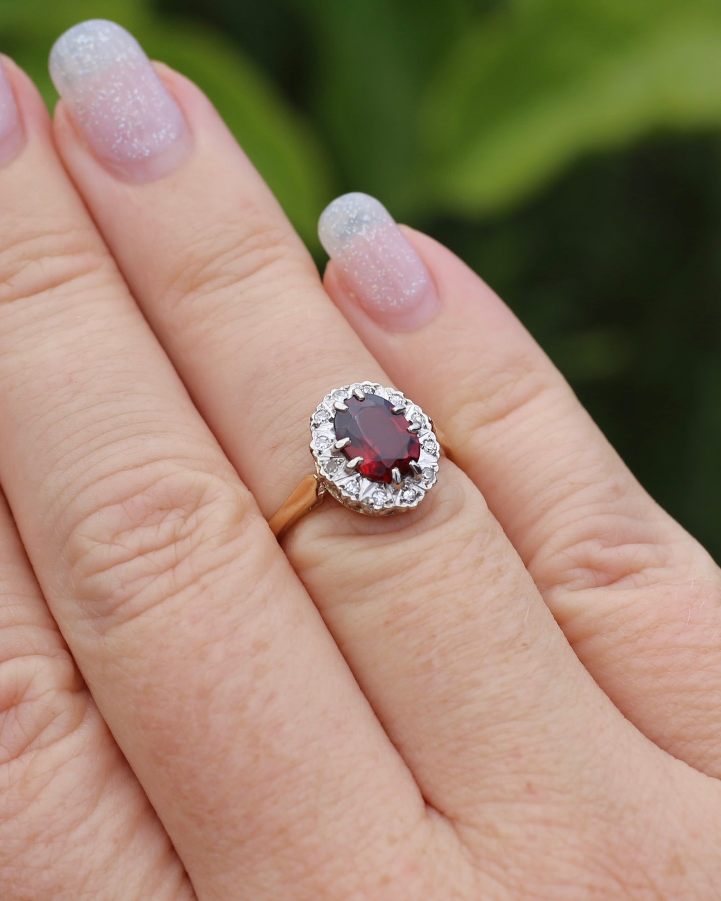 1974 Made Garnet and Diamond Halo Ring, 9ct Yellow and White Gold, size M1/2 or 6.5, 2.83g