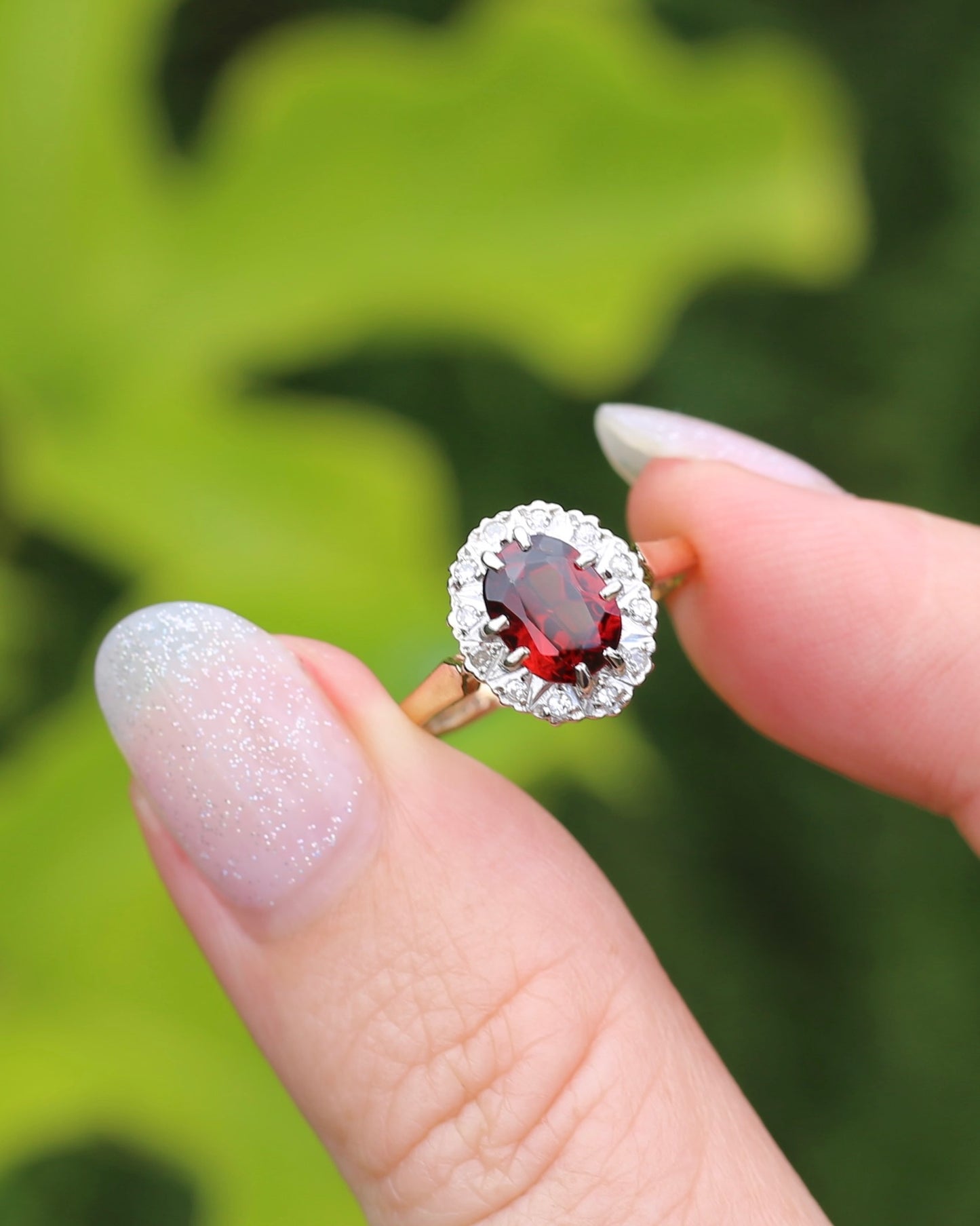 1974 Made Garnet and Diamond Halo Ring, 9ct Yellow and White Gold, size M1/2 or 6.5, 2.83g