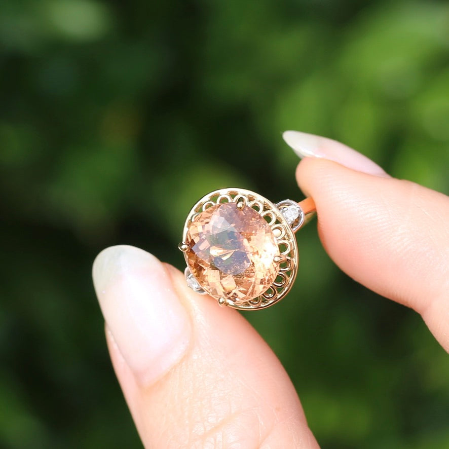 Oval Peach Tourmaline Ring with Pierced Wire Surrounds and Diamonds in the Shoulders, 9ct Yellow Gold, size N or 6.75