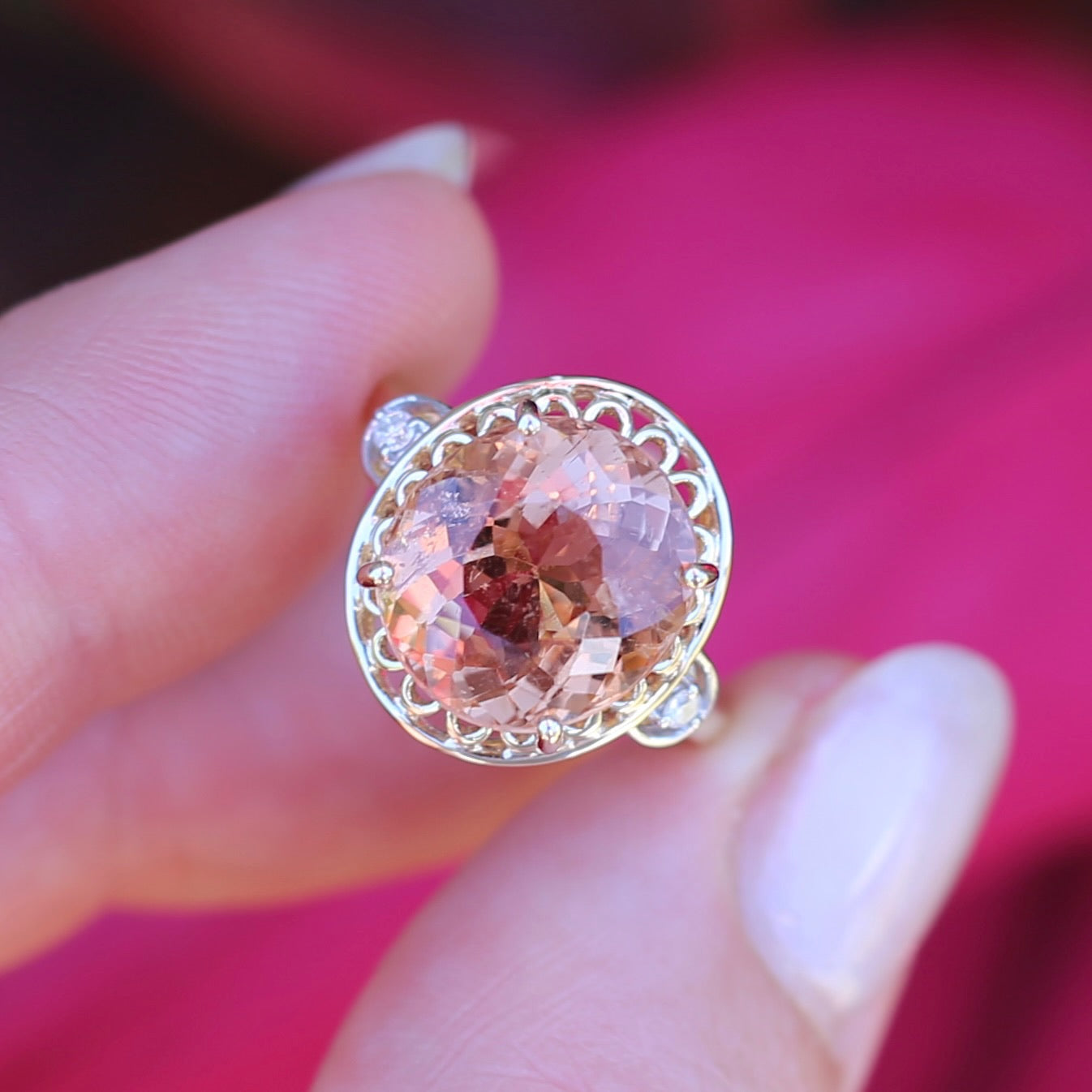 Oval Pale Orange Tourmaline Ring with Pierced Wire Surrounds and Diamonds in the Shoulders, 9ct Yellow Gold, size N or 6.75