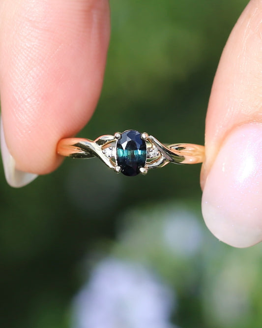0.7ct Dark Blue with Teal River Australian Sapphire with Diamond Side Stones Ring, 9ct Yellow Gold, size 8 or Q, 1.65g